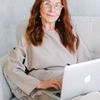 Portrait of a smiling woman, testimonial provider.